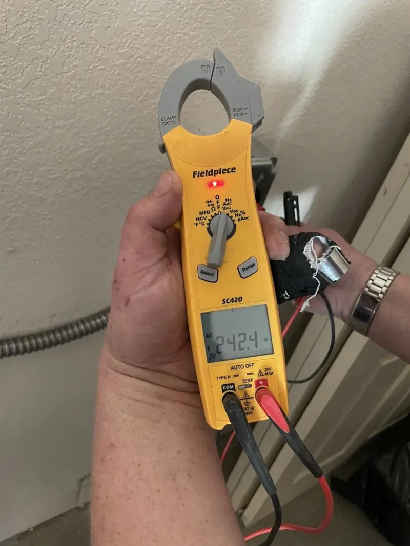 Voltage testing with clamp meter during Outlet Installation in Lafayette